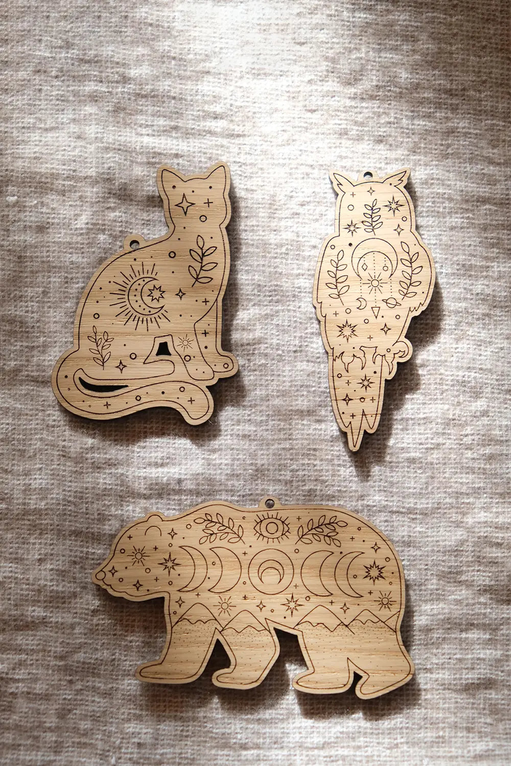 Boule de sapin en bois "Animaux sacrés"